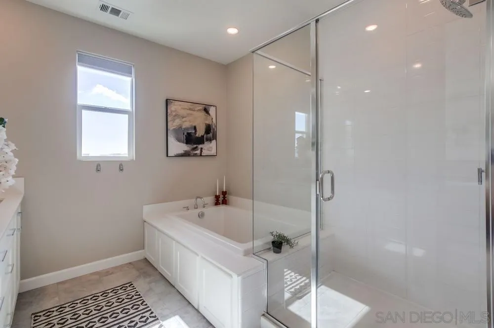 1956 Infinity Lane Chula Vista, CA 91915 - Photo 16 of 58 a bathroom with a bathtub and a shower