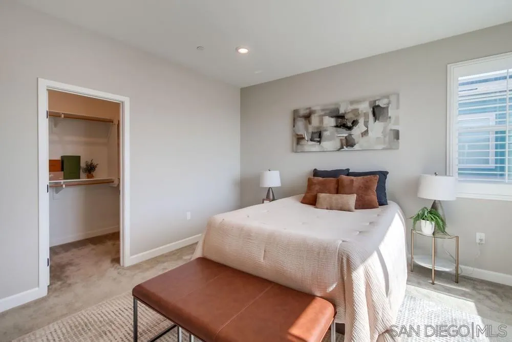 1956 Infinity Lane Chula Vista, CA 91915 - Photo 17 of 58 a bedroom with a bed and a table