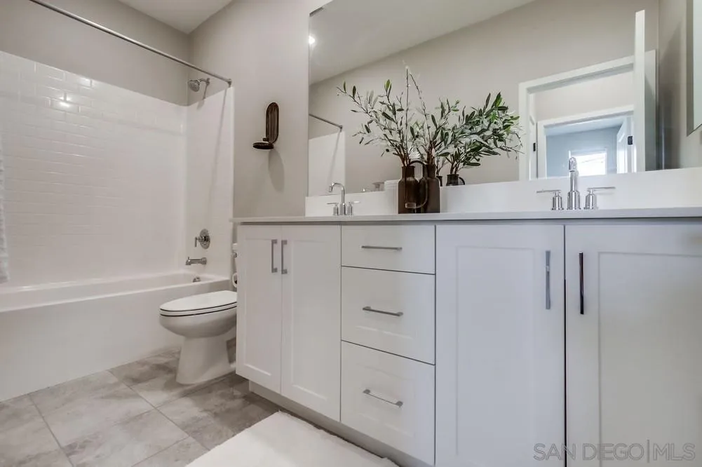1956 Infinity Lane Chula Vista, CA 91915 - Photo 19 of 58 a bathroom with a toilet sink and shower