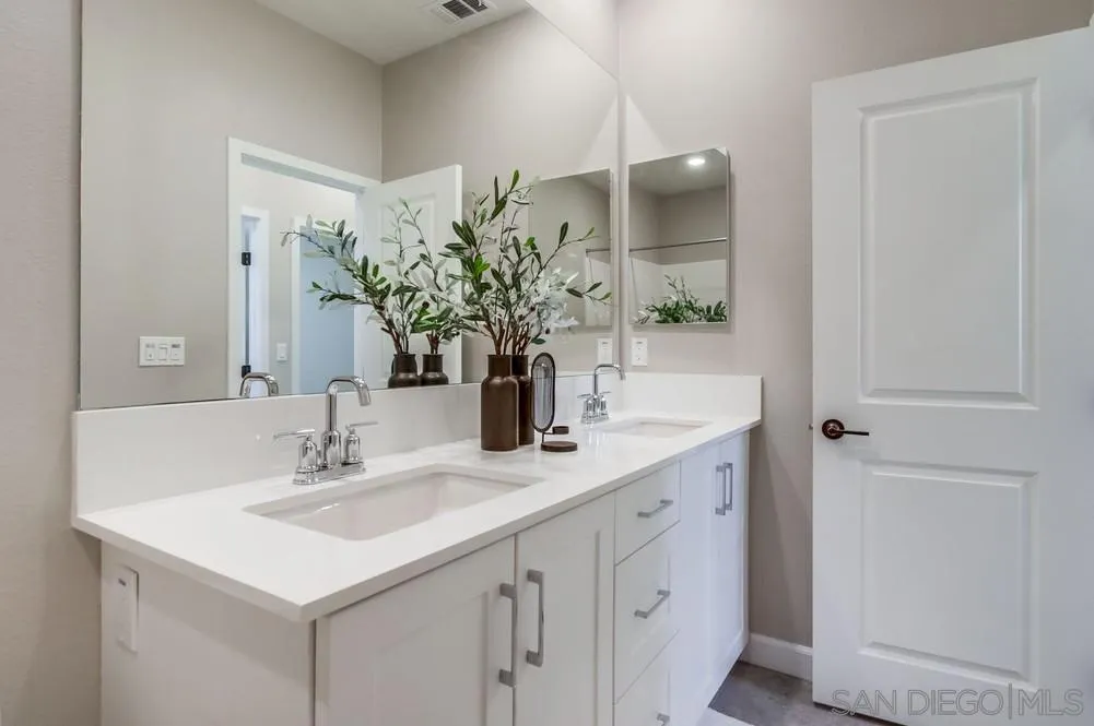 1956 Infinity Lane Chula Vista, CA 91915 - Photo 21 of 58 a bathroom with a sink and a mirror