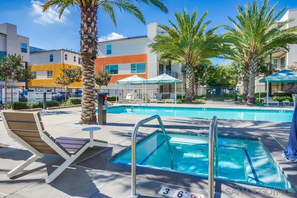 1956 Infinity Lane Chula Vista, CA 91915 - Photo 30 of 58 a swimming pool with outdoor seating and yard