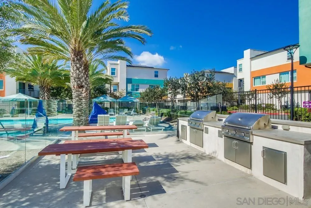 1956 Infinity Lane Chula Vista, CA 91915 - Photo 32 of 58 a view of a patio with couches and table and chairs and potted plants
