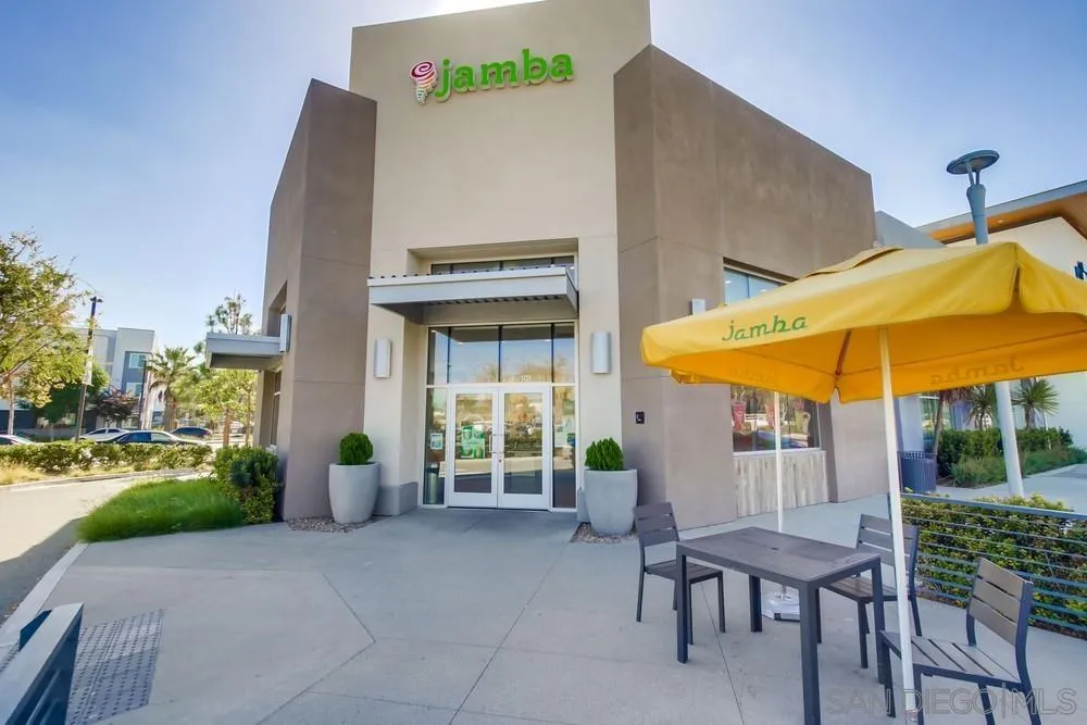 1956 Infinity Lane Chula Vista, CA 91915 - Photo 49 of 58 a view of a patio with a table and chairs under an umbrella