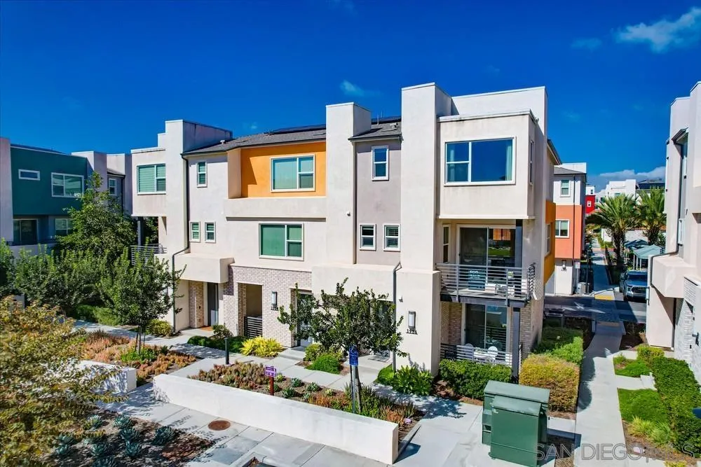 1956 Infinity Lane Chula Vista, CA 91915 - Photo 58 of 58 a front view of a multi story residential apartment building with yard