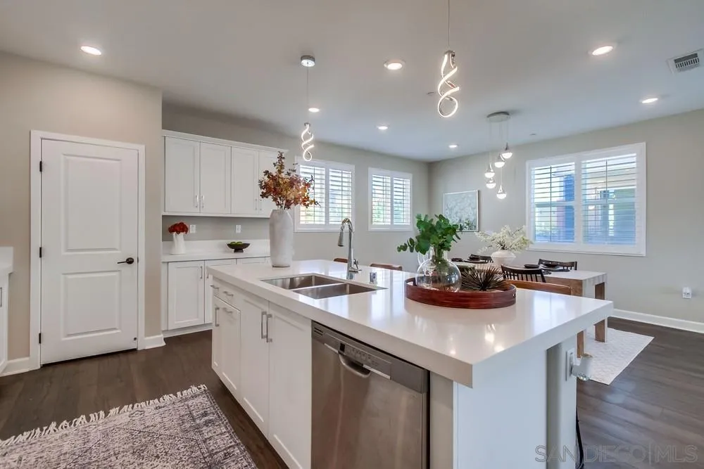1956 Infinity Lane Chula Vista, CA 91915 - Photo 10 of 58 a kitchen with a sink a stove and cabinets