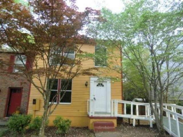 858 Regal Path Lane Decatur, GA 30030 - Photo 1 of 1 front view of a house with a trees