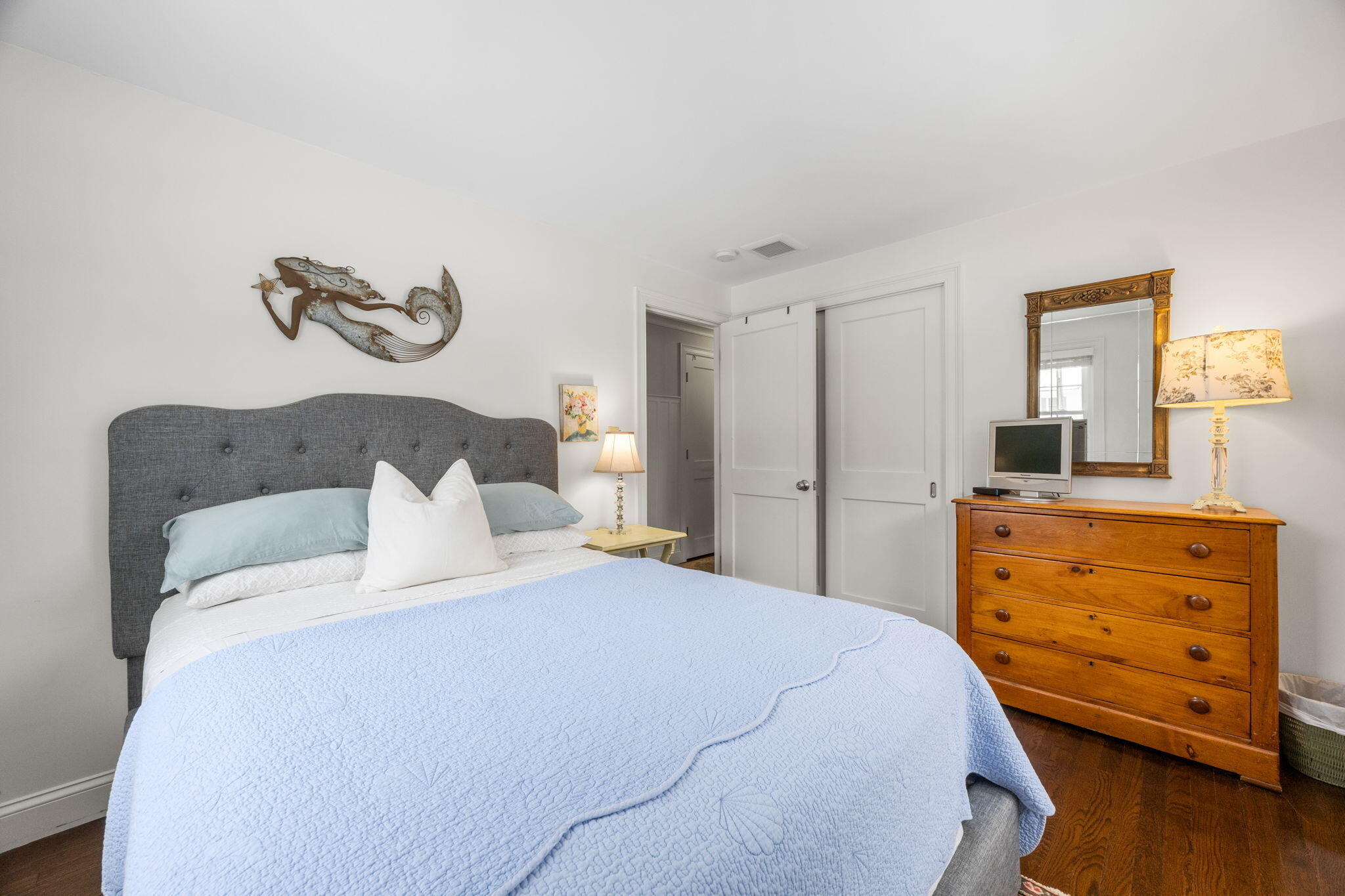 137 Shane Drive Chatham, MA 02633 - Photo 23 of 46 a bedroom with a bed and wooden floor