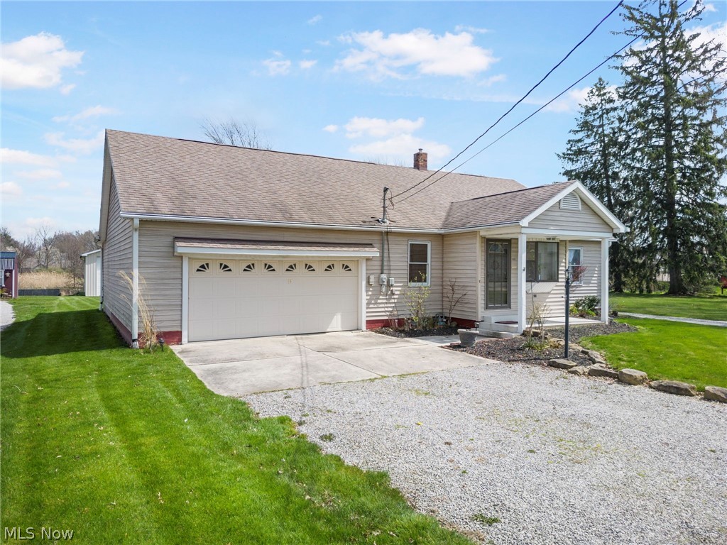 1850 South Sawburg Road Alliance, OH 44601 - Photo 2 of 39 1.5 style home with a 2-3 attached tandem garage and a front lawn