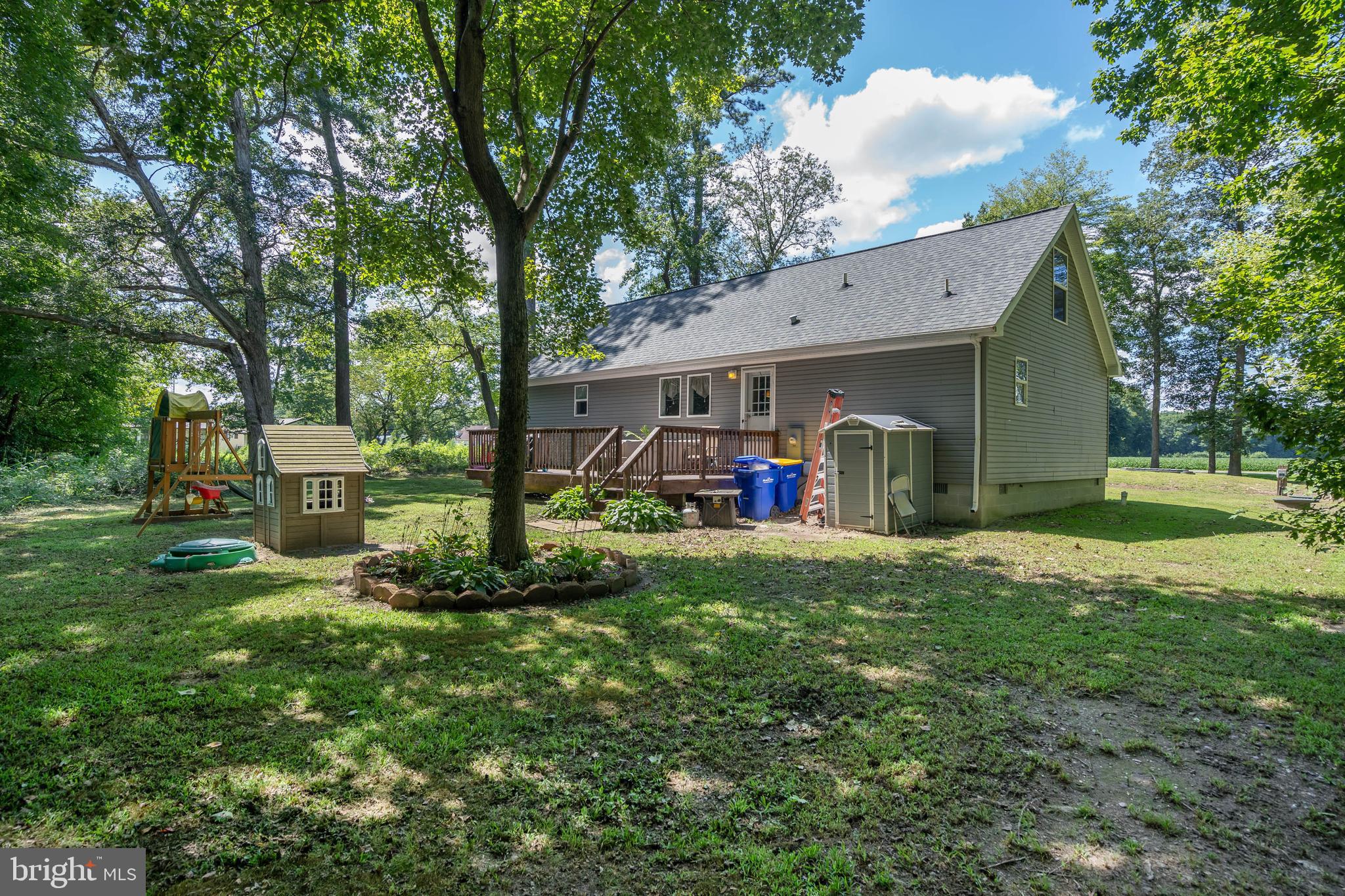 24335 Shortly Road Georgetown, DE 19947 - Photo 27 of 29 a view of a house with a backyard and a patio