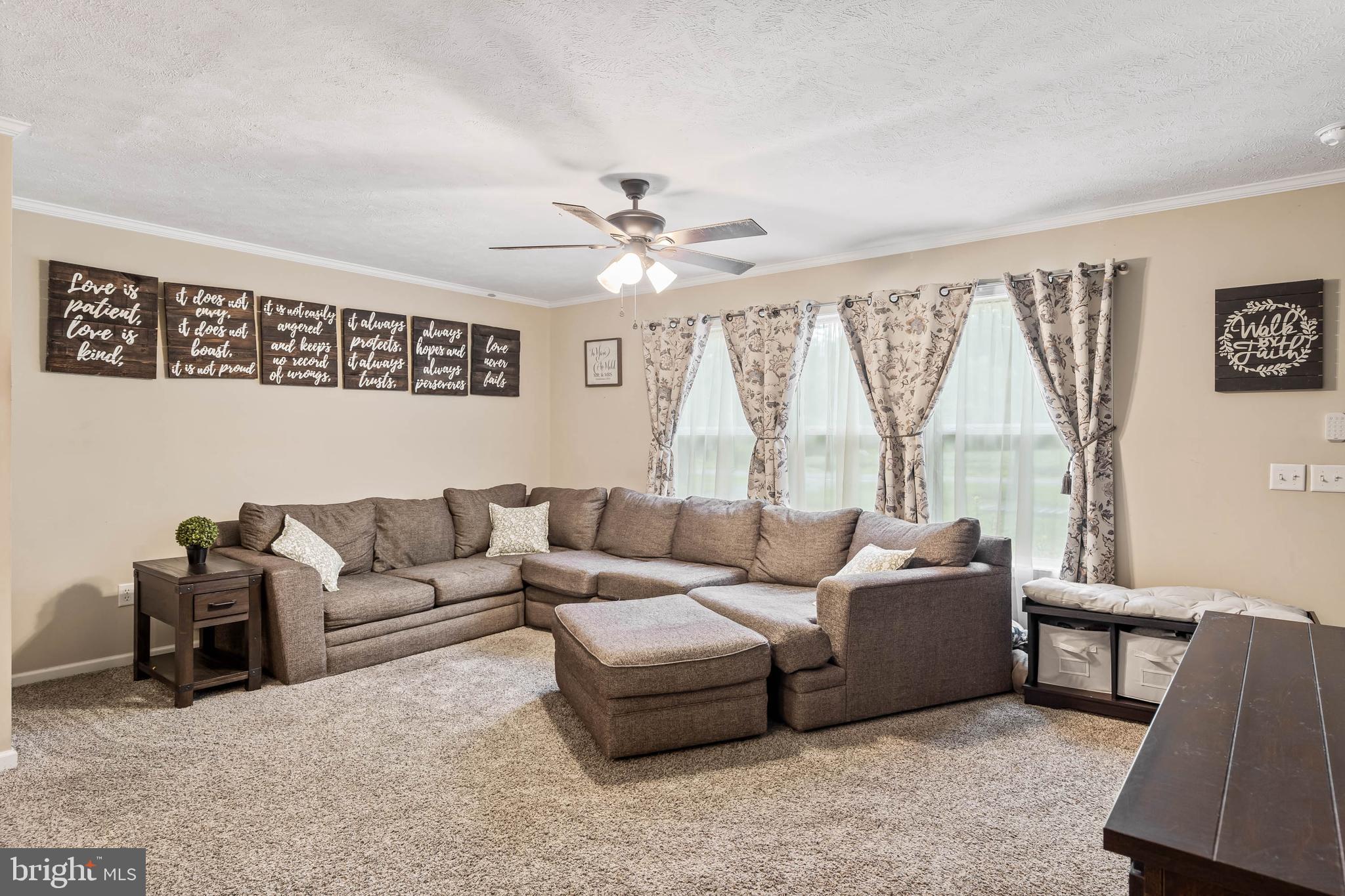 24335 Shortly Road Georgetown, DE 19947 - Photo 6 of 29 a living room with furniture and a large window