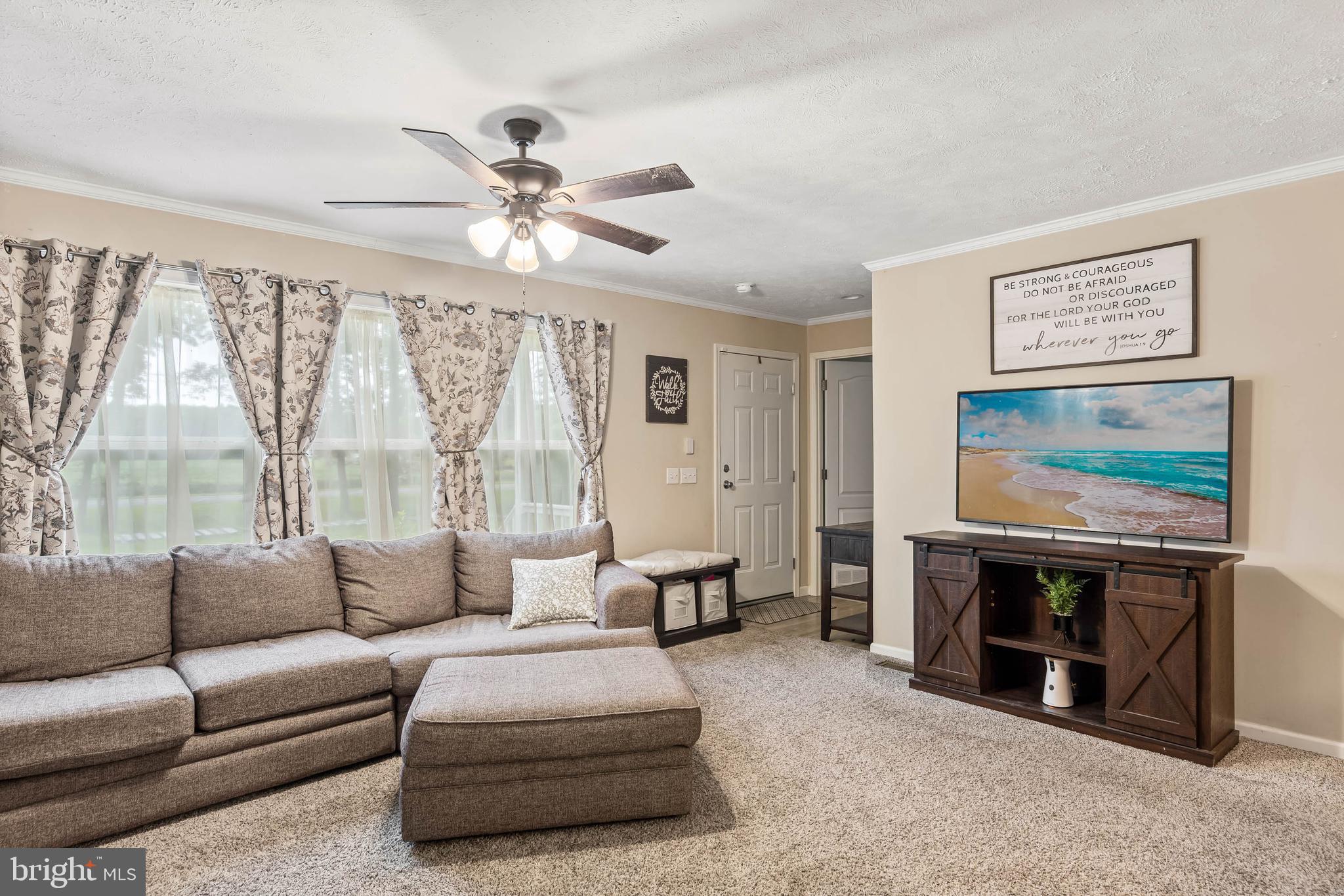 24335 Shortly Road Georgetown, DE 19947 - Photo 7 of 29 a living room with furniture and a fireplace