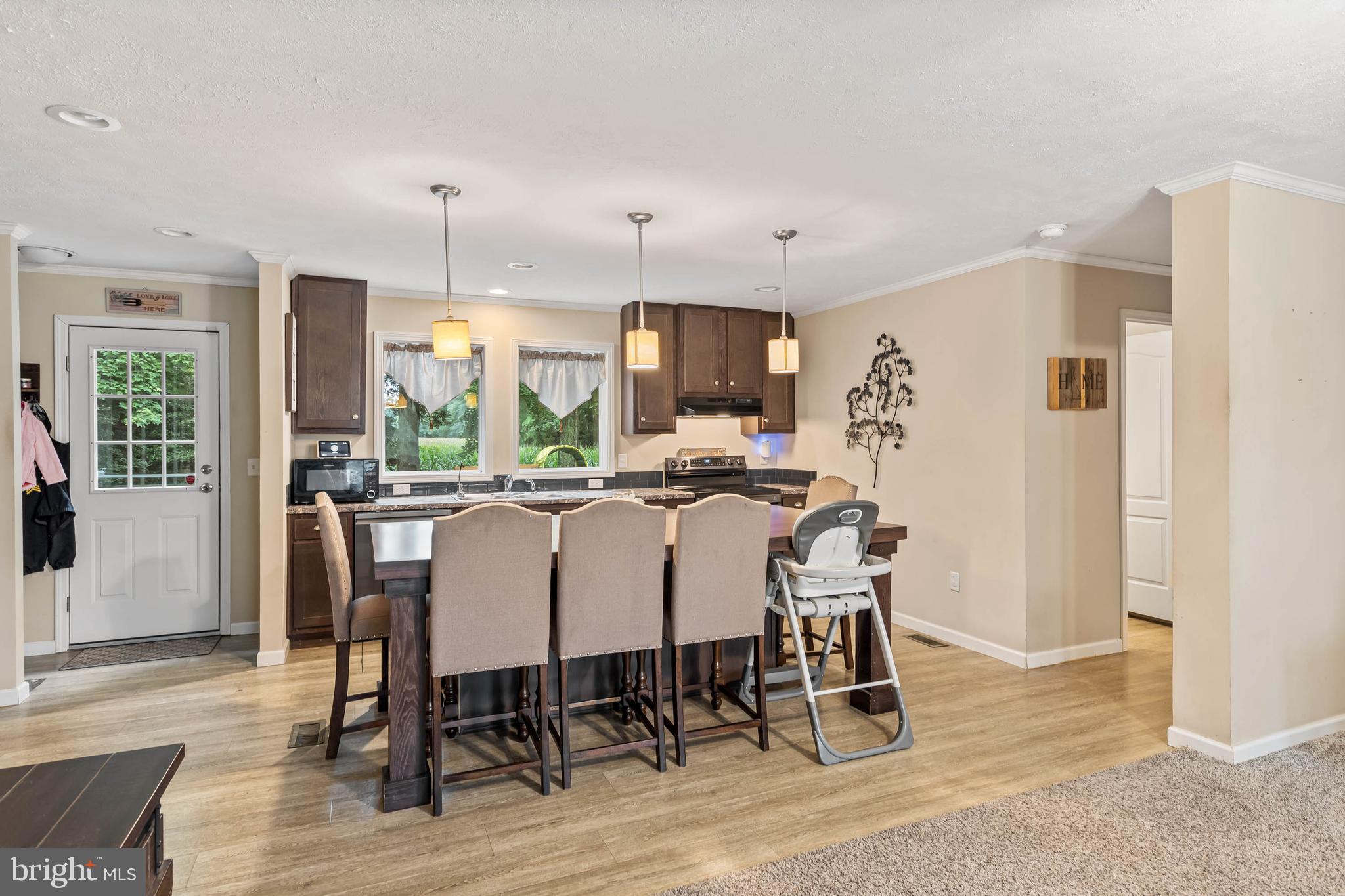 24335 Shortly Road Georgetown, DE 19947 - Photo 9 of 29 a view of a dining room with furniture window and wooden floor