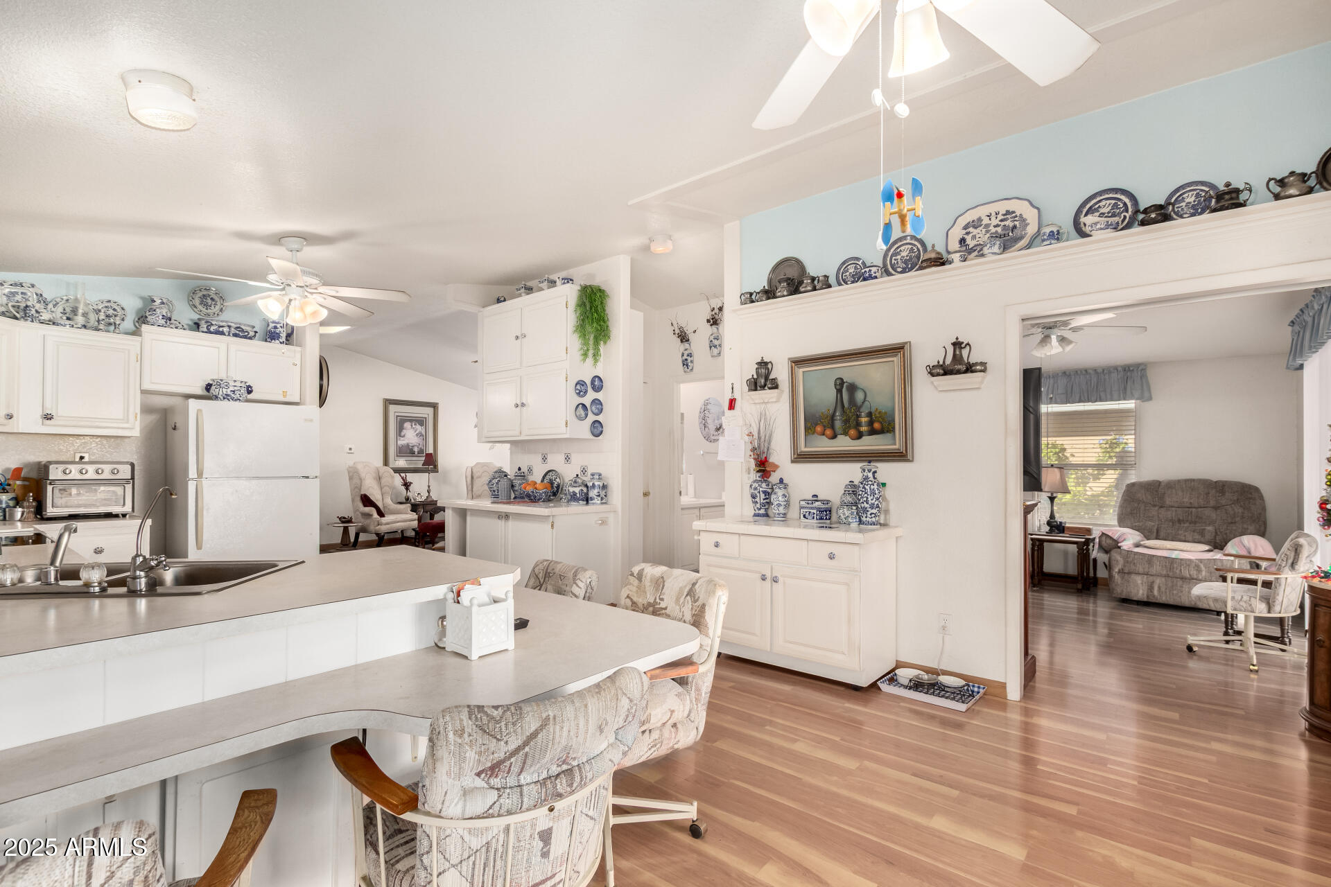 2400 East Baseline Avenue, Unit 148 Apache Junction, AZ 85119 - Photo 16 of 42 a living room with furniture and wooden floor
