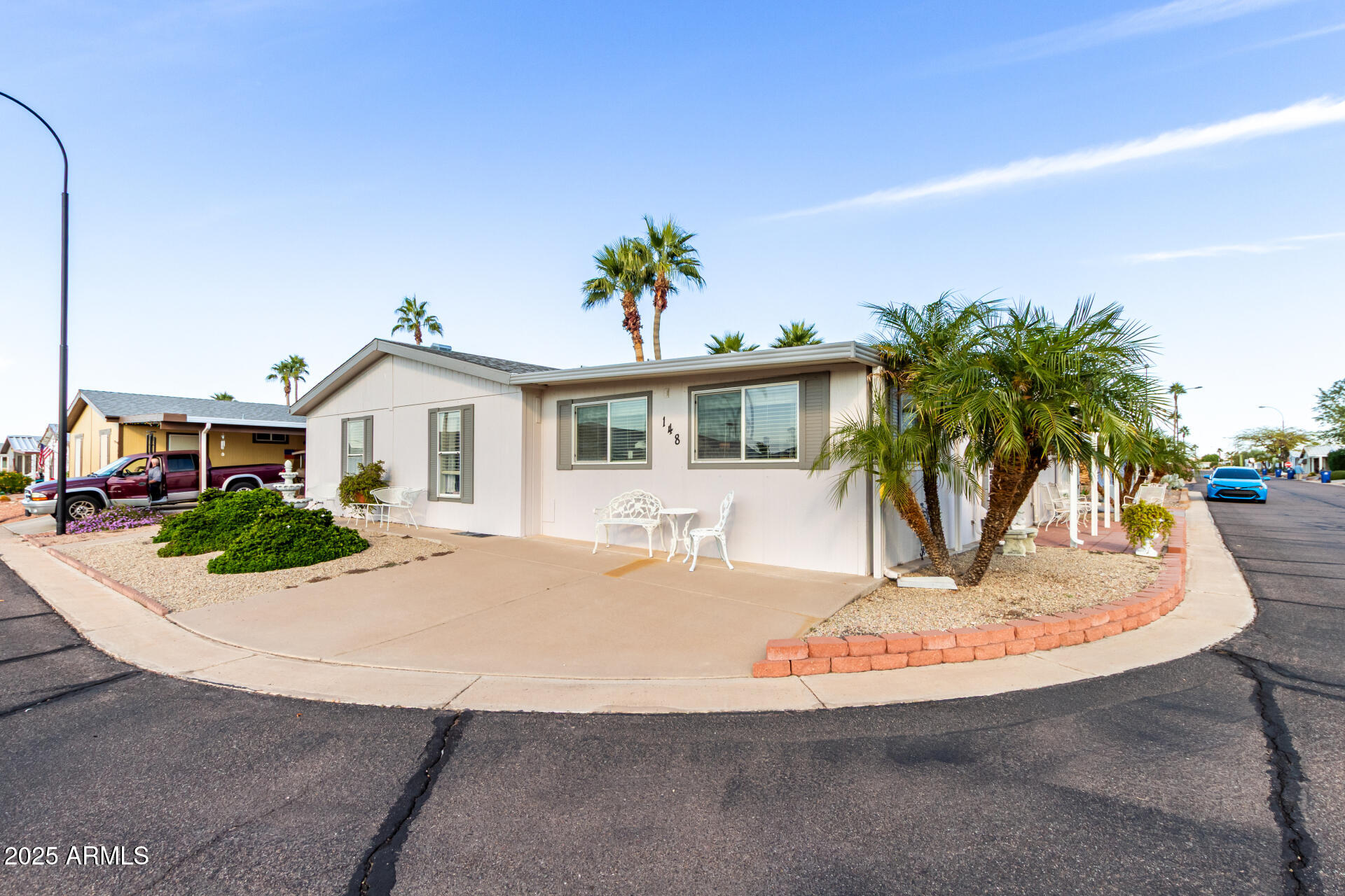 2400 East Baseline Avenue, Unit 148 Apache Junction, AZ 85119 - Photo 2 of 42 a view of a house with a patio