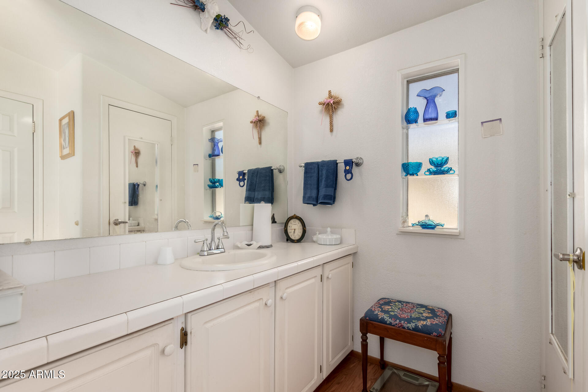 2400 East Baseline Avenue, Unit 148 Apache Junction, AZ 85119 - Photo 23 of 42 a bathroom with a sink and a mirror