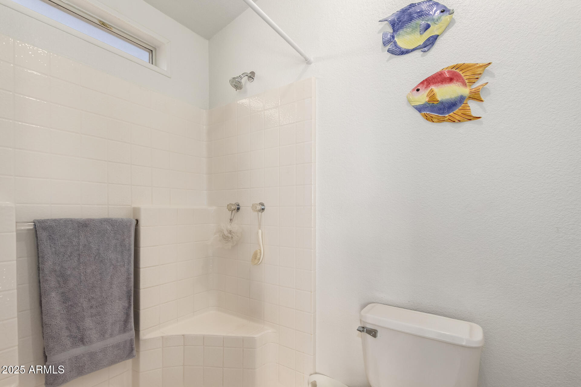 2400 East Baseline Avenue, Unit 148 Apache Junction, AZ 85119 - Photo 24 of 42 a bathroom with a shower and a toilet