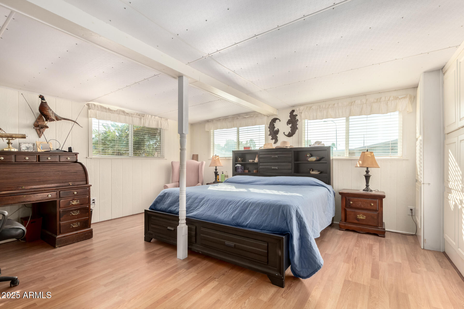 2400 East Baseline Avenue, Unit 148 Apache Junction, AZ 85119 - Photo 25 of 42 a bedroom with a bed and a fireplace