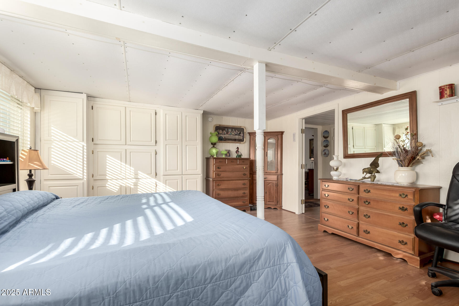 2400 East Baseline Avenue, Unit 148 Apache Junction, AZ 85119 - Photo 26 of 42 a bedroom with a bed and a dresser