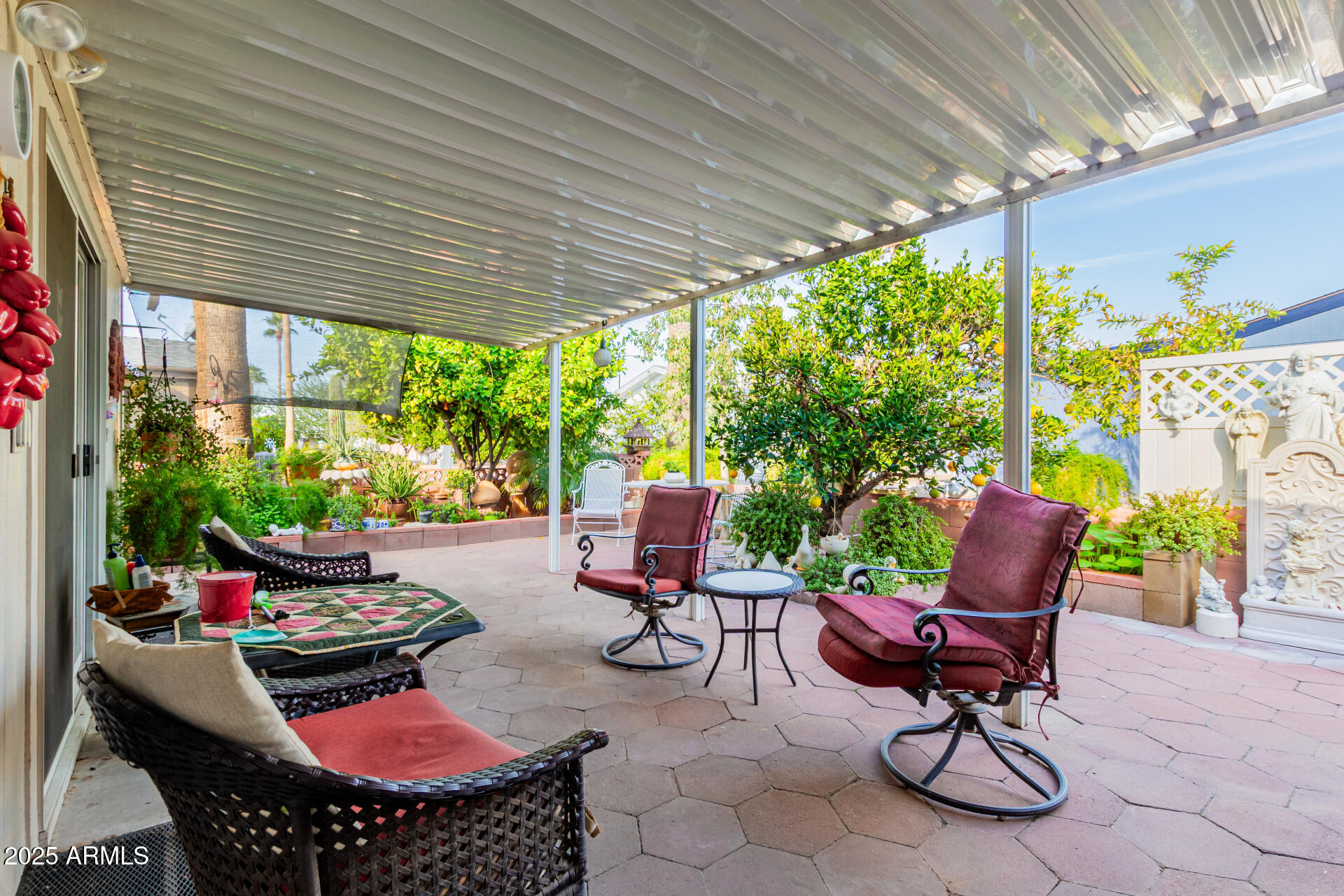 2400 East Baseline Avenue, Unit 148 Apache Junction, AZ 85119 - Photo 32 of 42 a view of a patio with chairs and tables