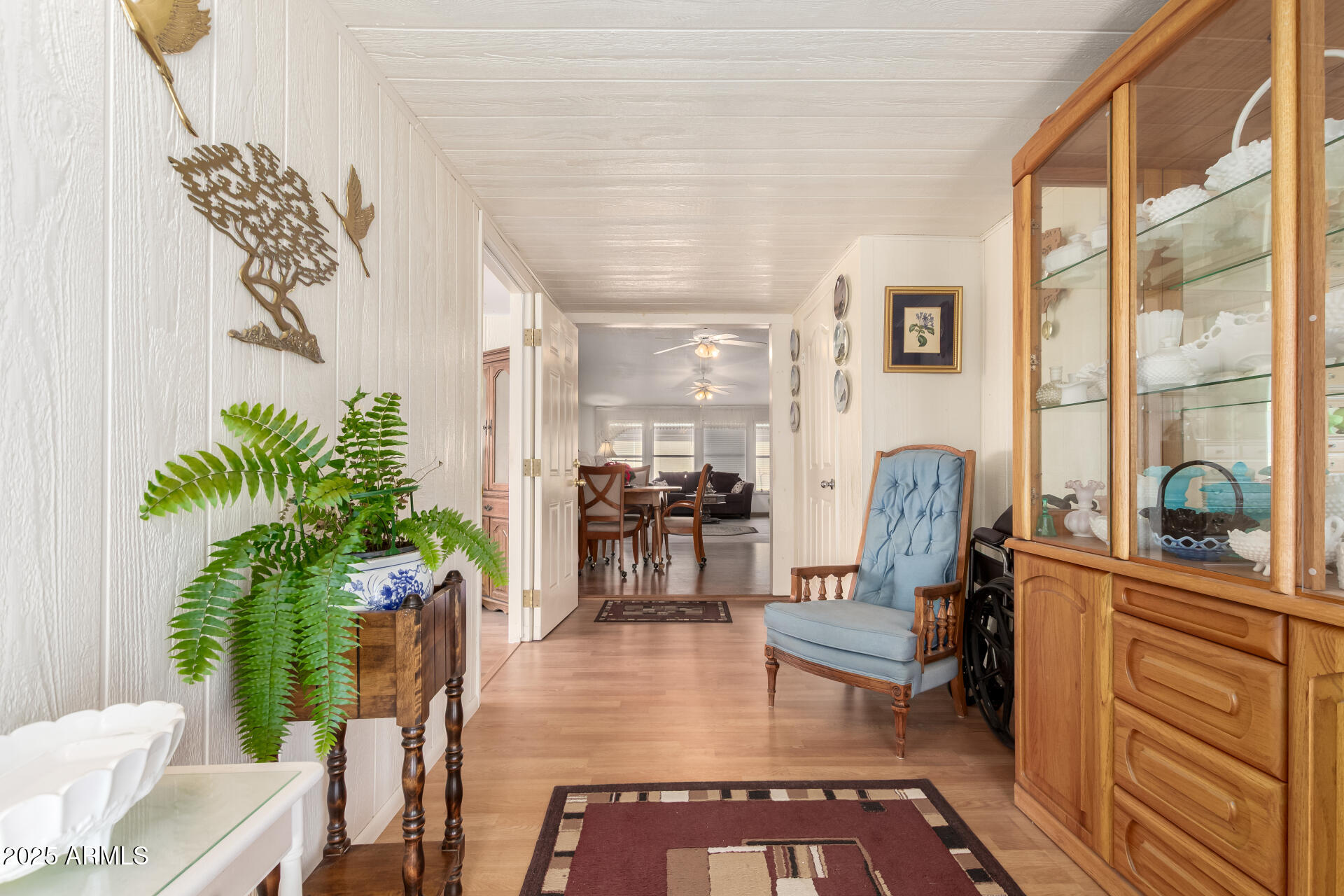 2400 East Baseline Avenue, Unit 148 Apache Junction, AZ 85119 - Photo 7 of 42 a living room with furniture a potted plant and a large window