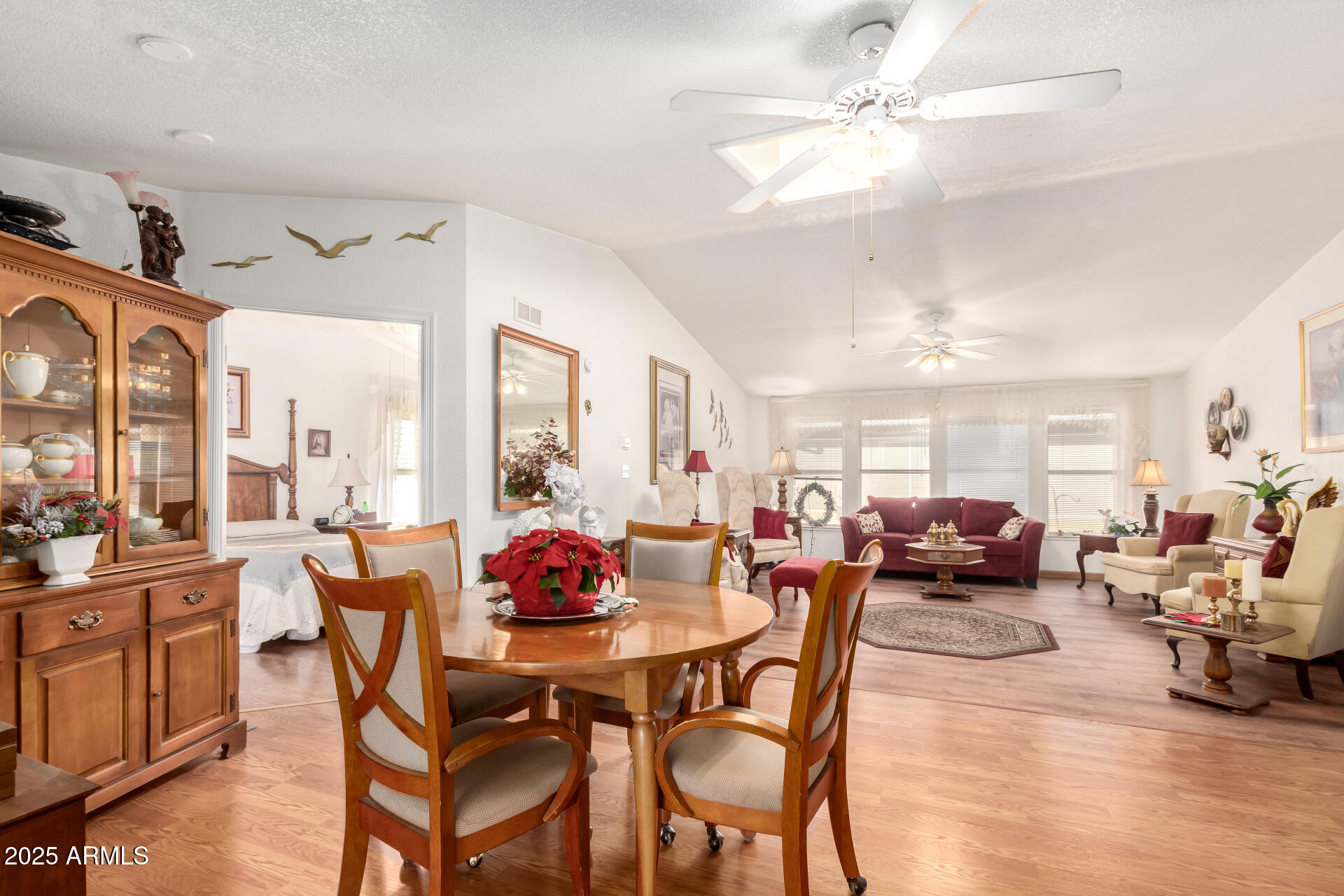 2400 East Baseline Avenue, Unit 148 Apache Junction, AZ 85119 - Photo 9 of 42 a view of a dining room with furniture window and wooden floor