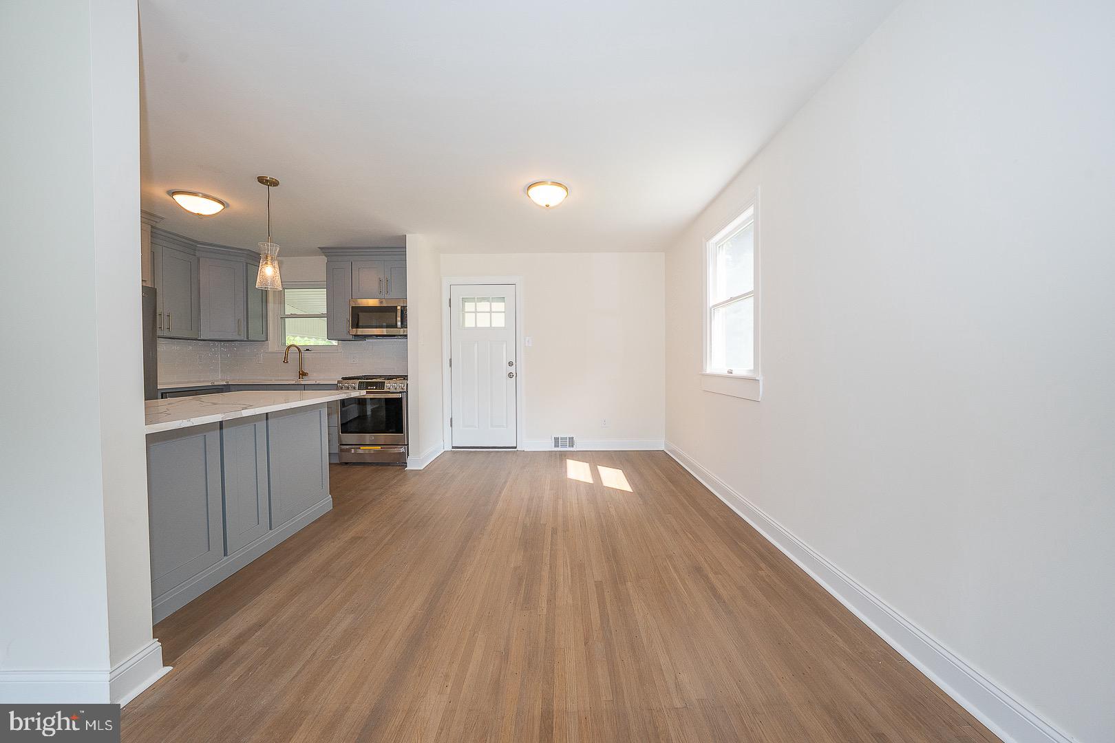 503 Poplar Road Flourtown, PA 19031 - Photo 13 of 63 a view of kitchen with wooden floor electronic appliances and window