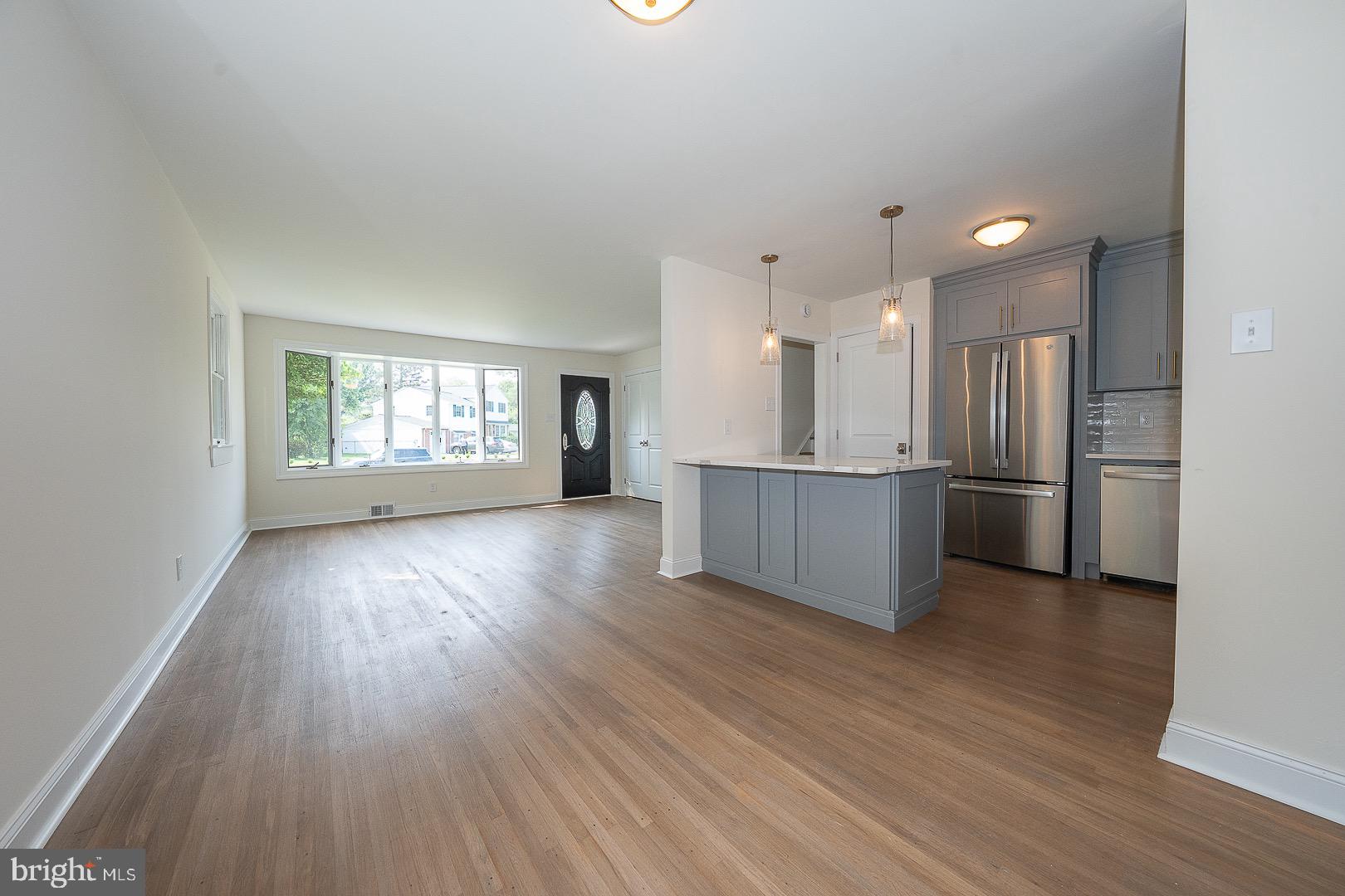 503 Poplar Road Flourtown, PA 19031 - Photo 15 of 63 a view of a kitchen with wooden floor and a window