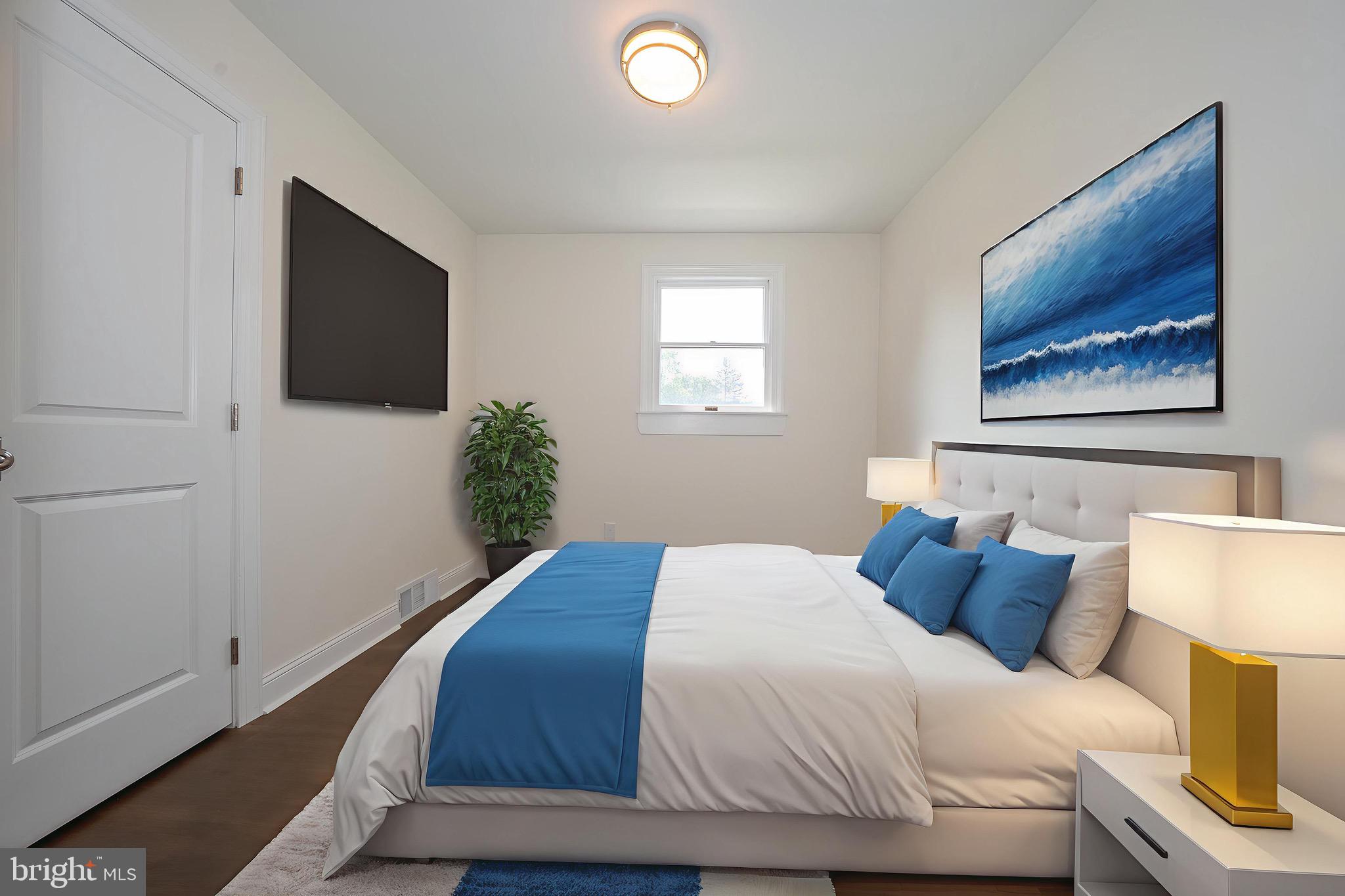 503 Poplar Road Flourtown, PA 19031 - Photo 23 of 63 a bedroom with a bed and a flat screen tv
