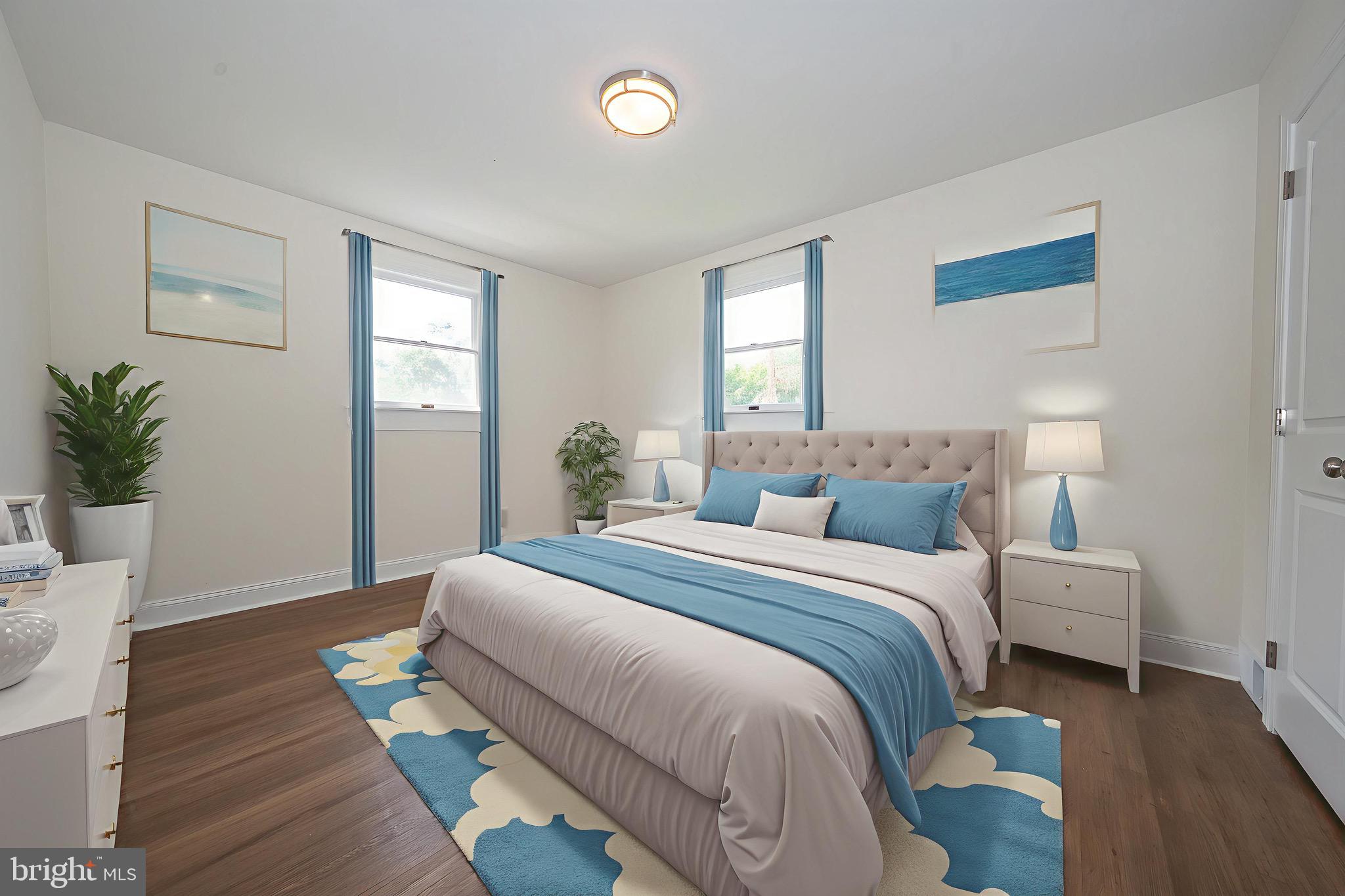 503 Poplar Road Flourtown, PA 19031 - Photo 26 of 63 a bedroom with a bed and wooden floor