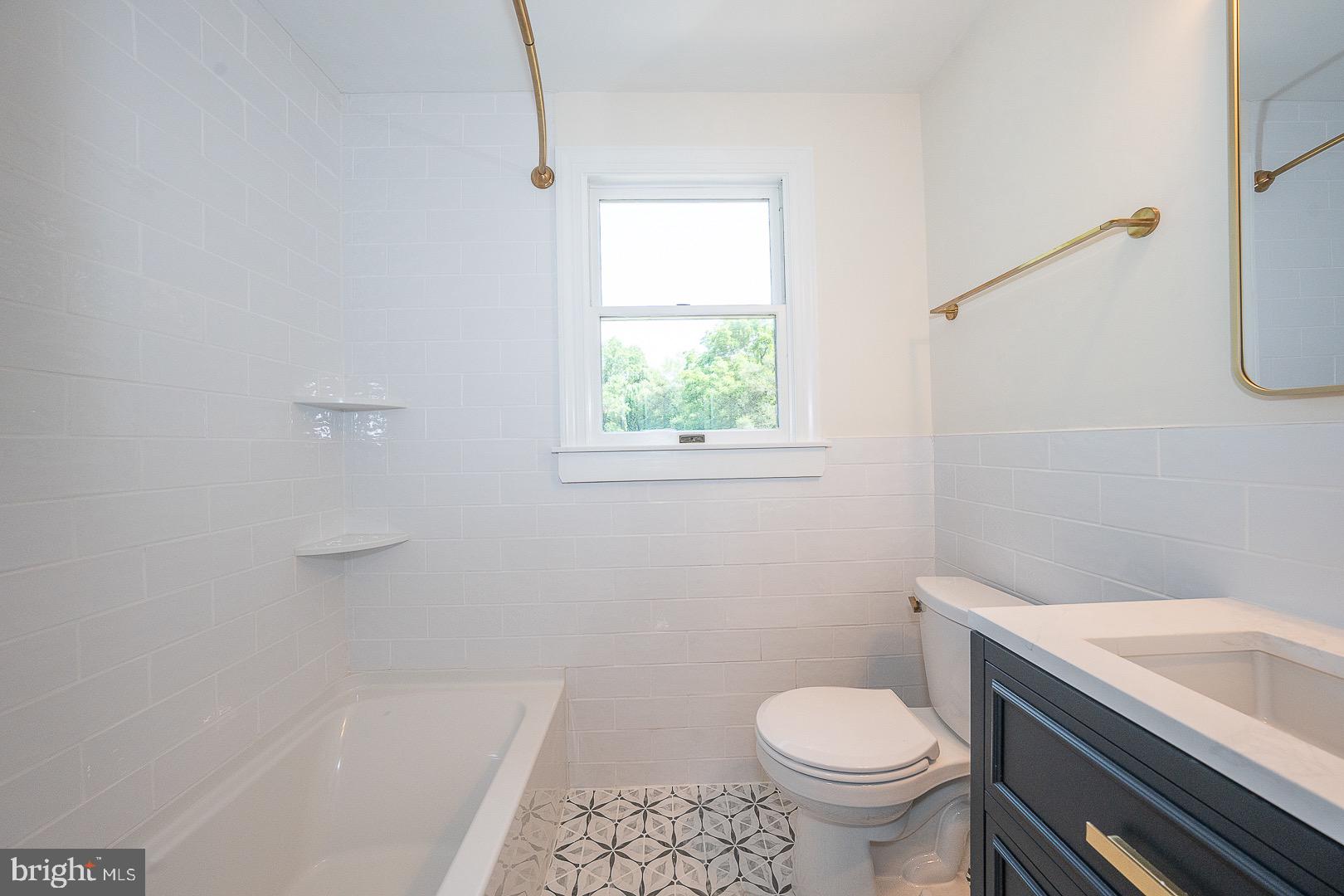 503 Poplar Road Flourtown, PA 19031 - Photo 35 of 63 a white toilet sitting next to a bath tub