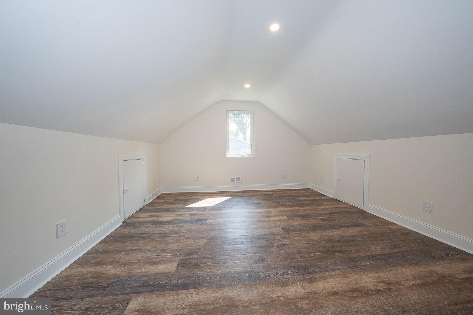 503 Poplar Road Flourtown, PA 19031 - Photo 39 of 63 an empty room with wooden floor and windows