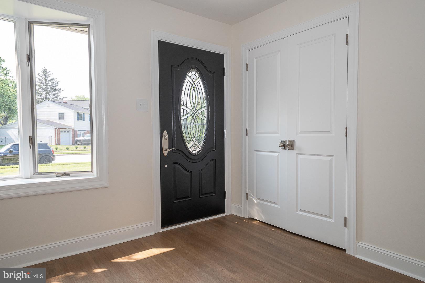503 Poplar Road Flourtown, PA 19031 - Photo 5 of 63 a view of a hallway with wooden floor and windows