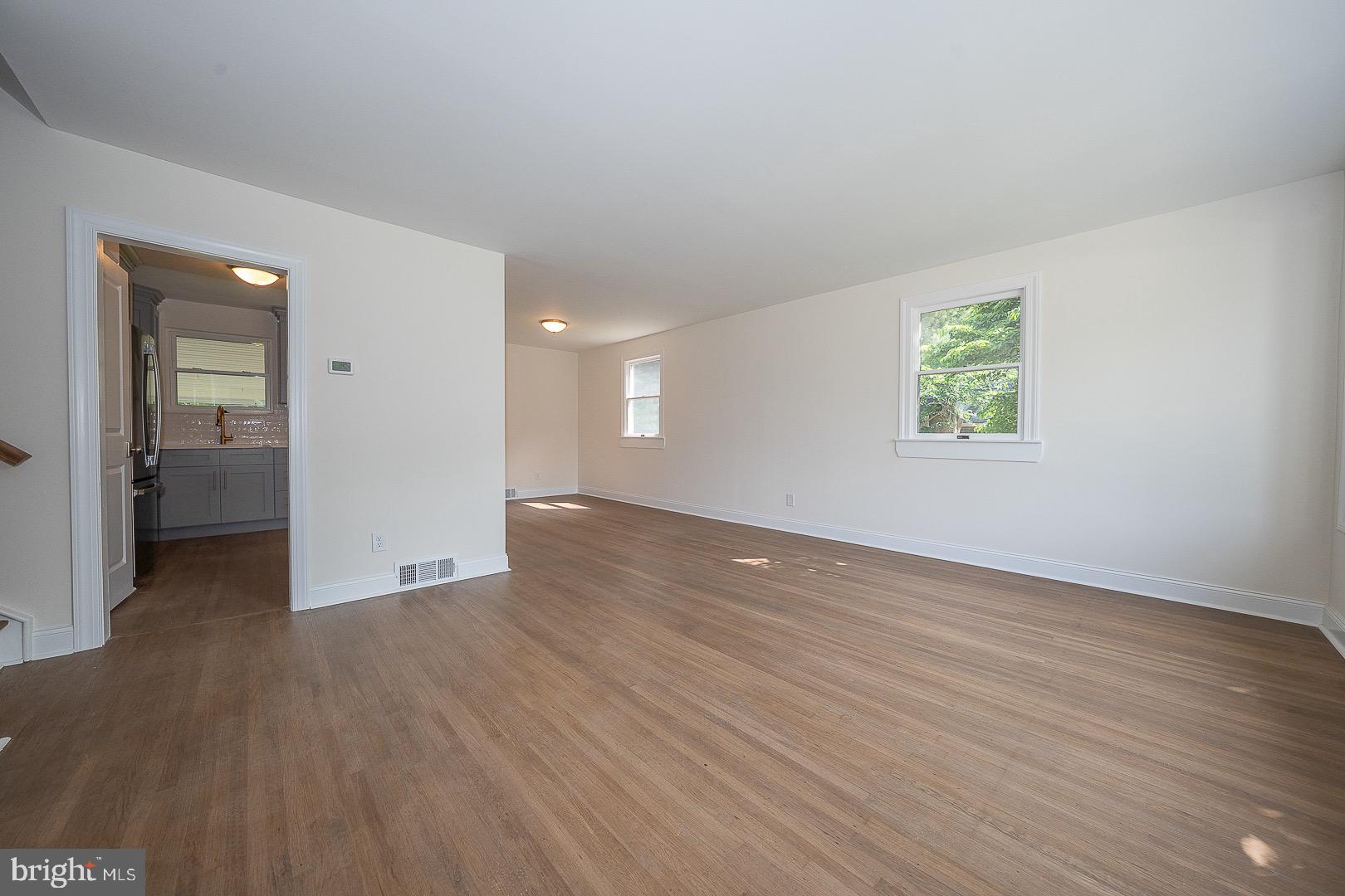 503 Poplar Road Flourtown, PA 19031 - Photo 7 of 63 an empty room with wooden floor & windows