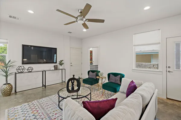 a living room with furniture and a flat screen tv