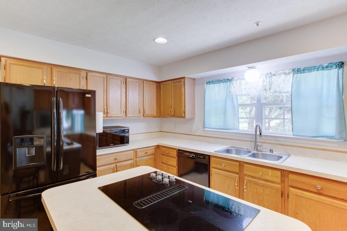 11601 Trillum Street Bowie, MD 20721 - Photo 32 of 36 Kitchen Center Island with Downdraft Cooktop