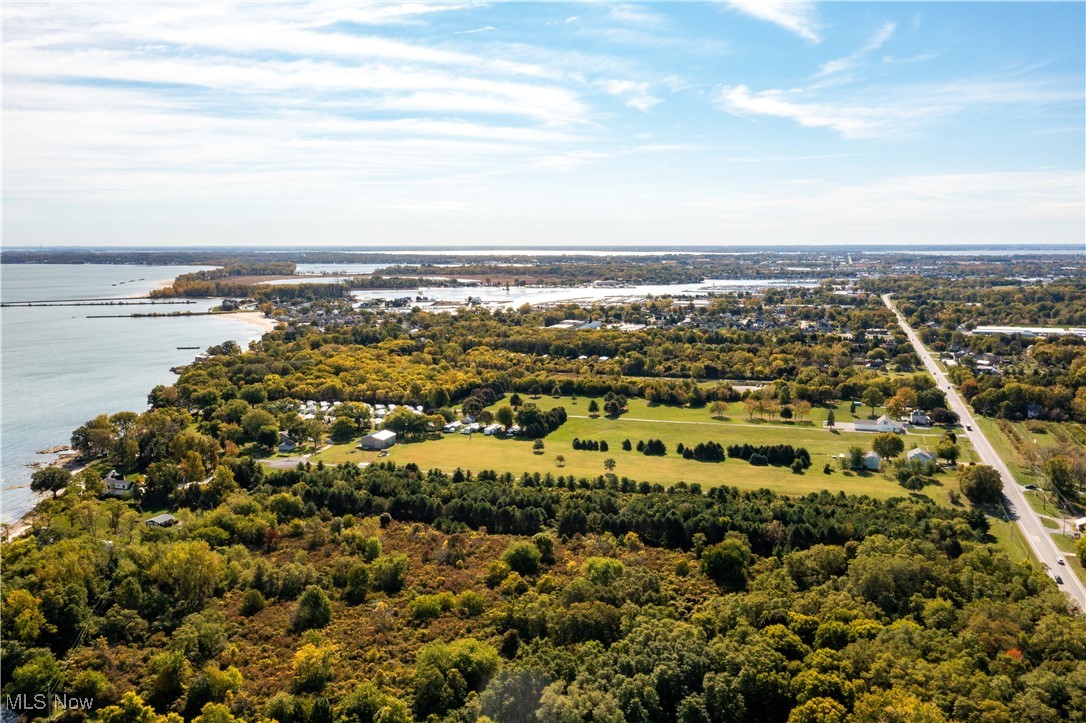 3621 Northeast Catawba Road Port Clinton, OH 43452 - Photo 14 of 18 Drone / aerial view of a nearby body of water and a forest