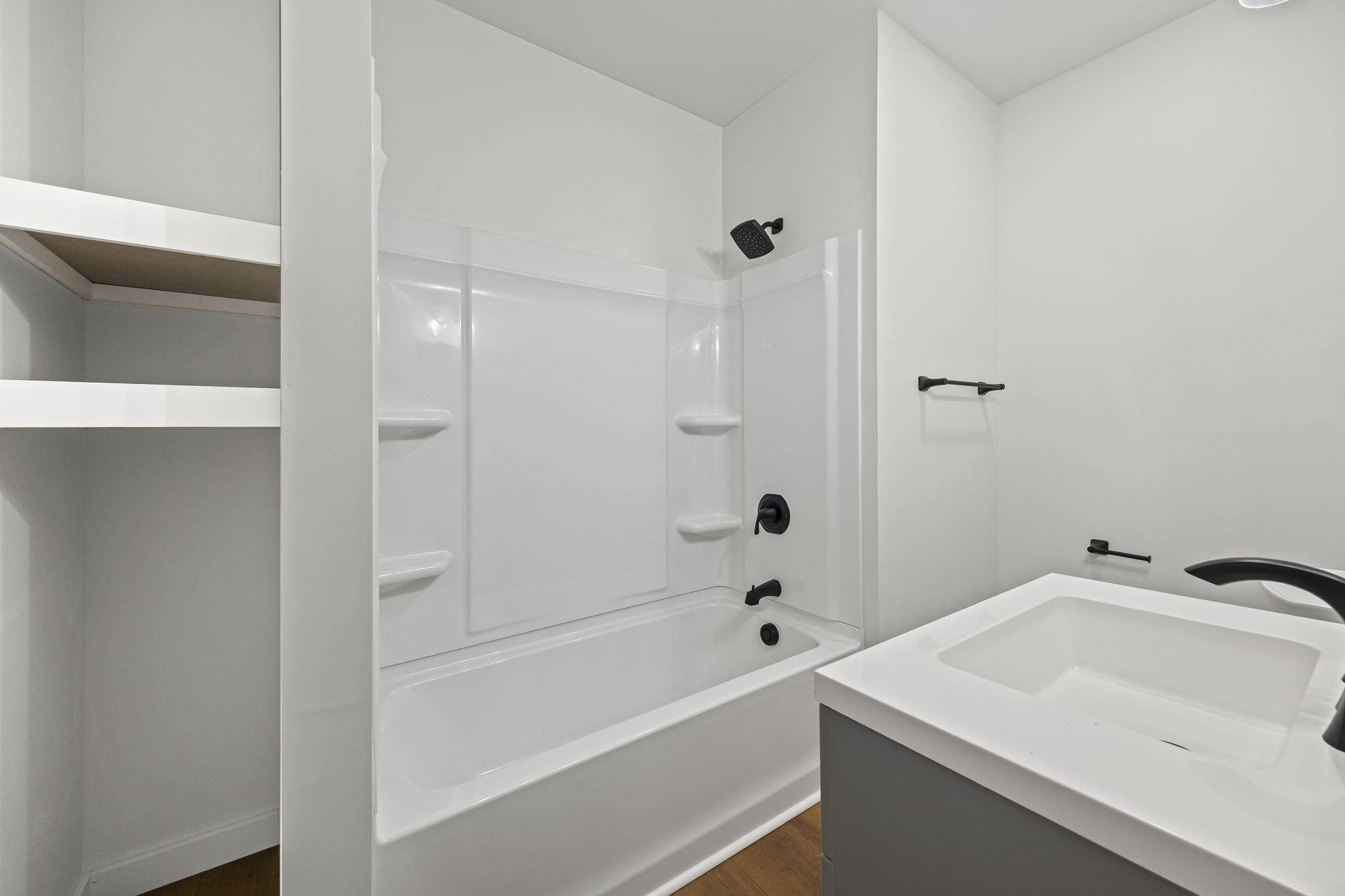 835 Curve Woodville Road Gates, TN 38037 - Photo 23 of 33 a bathroom with a sink and a bathtub