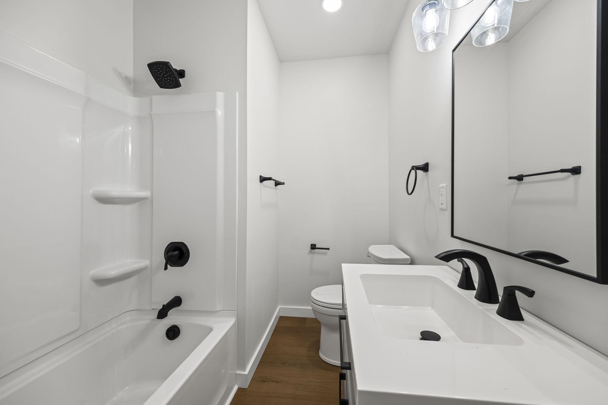 835 Curve Woodville Road Gates, TN 38037 - Photo 24 of 33 a bathroom with a sink a toilet and a bathtub