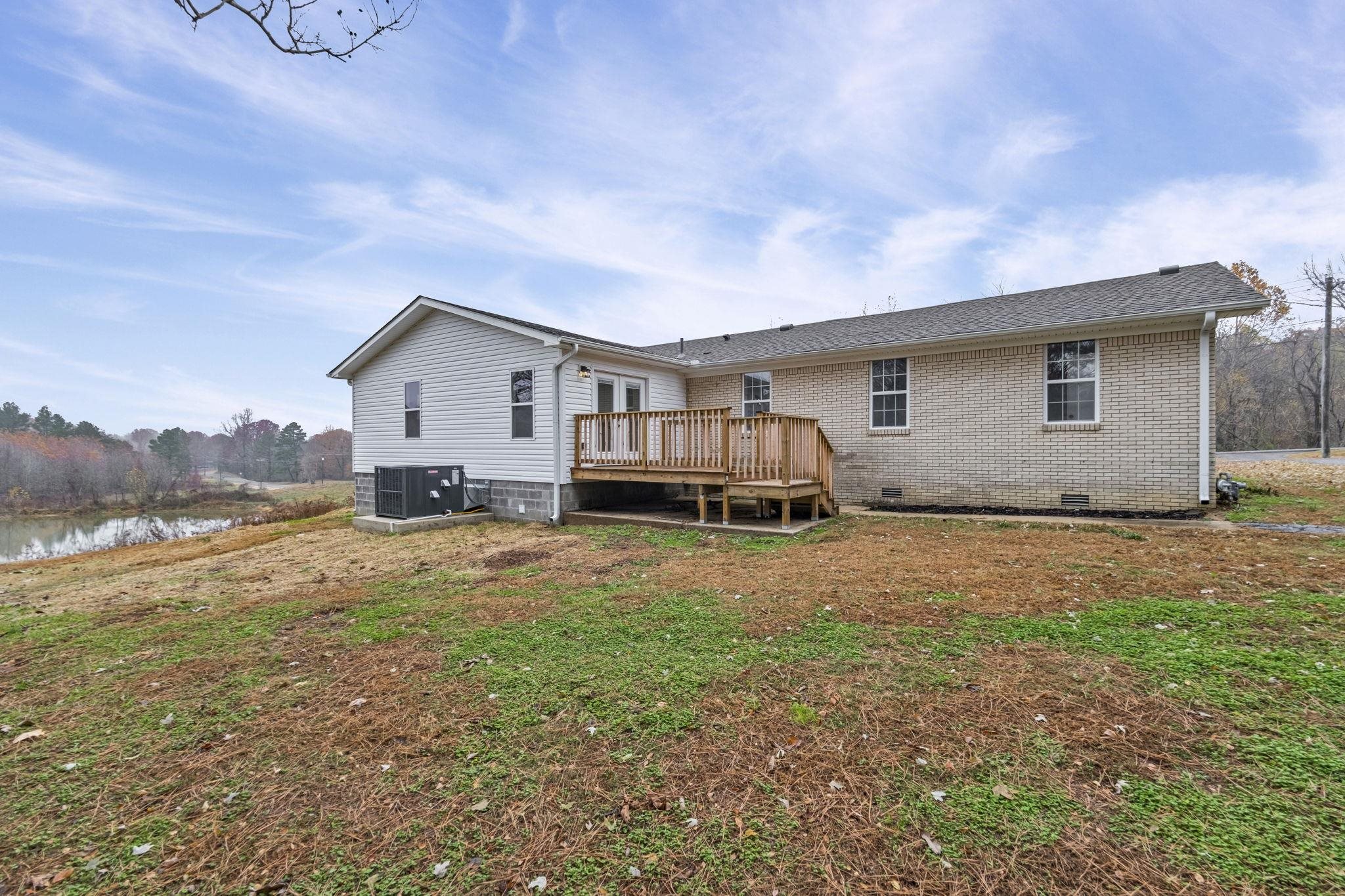835 Curve Woodville Road Gates, TN 38037 - Photo 29 of 33 a view of a house with backyard and trees