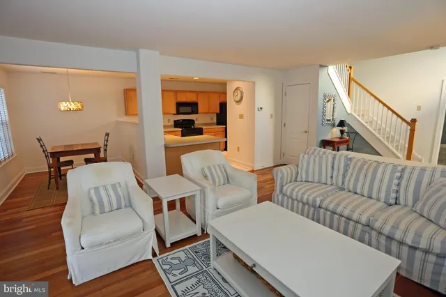 a living room with furniture fireplace and flat screen tv