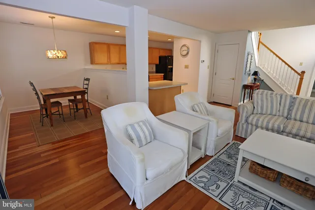 a kitchen with a sink a stove top oven and a refrigerator