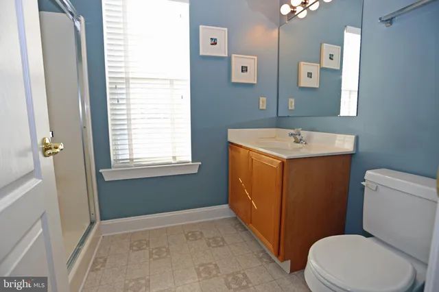 a view of entryway livingroom and hall with wooden floor