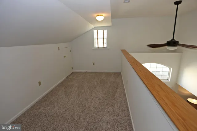 a bedroom with a bed and a chair