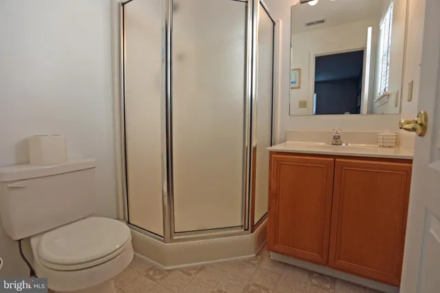 a large bed sitting in a bedroom next to a window