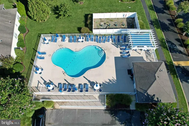 an aerial view of a house with swimming pool