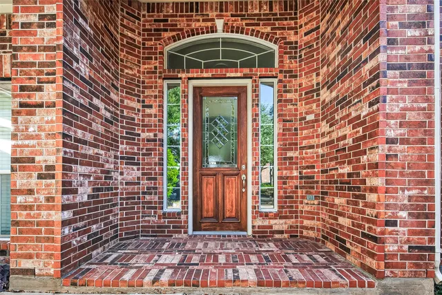 a view of entryway with wooden floor and stairs