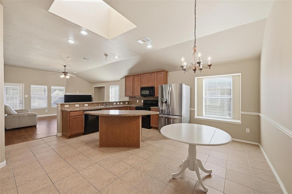 910 Fulbourne Drive Anna, TX 75409 - Photo 19 of 36 Kitchen with island and Dining Room