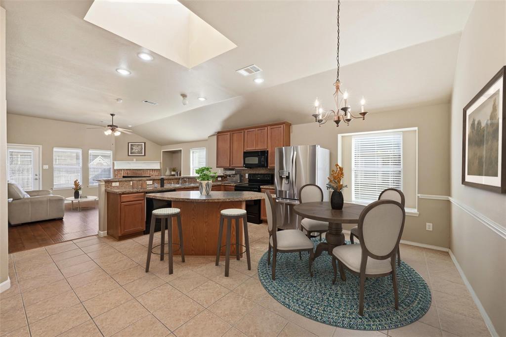 910 Fulbourne Drive Anna, TX 75409 - Photo 5 of 36 Kitchen with island and Dining Room