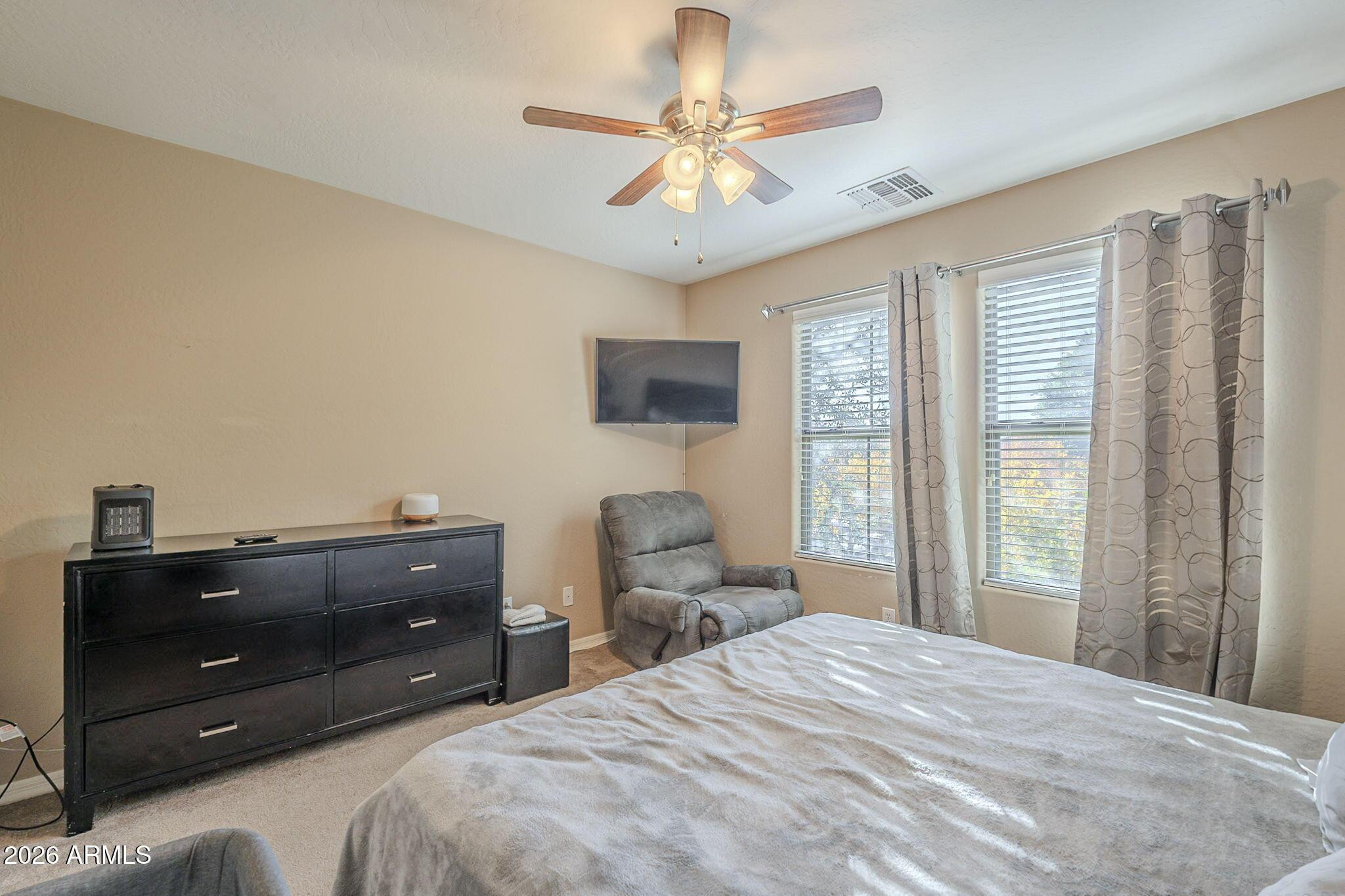 451 South Hawes Road, Unit 45 Mesa, AZ 85208 - Photo 17 of 36 a bedroom with a bed and window
