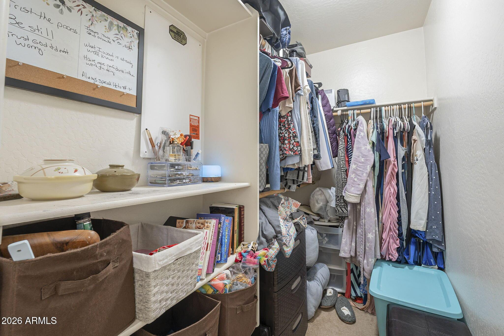 451 South Hawes Road, Unit 45 Mesa, AZ 85208 - Photo 20 of 36 a view of walk in closet with clothes